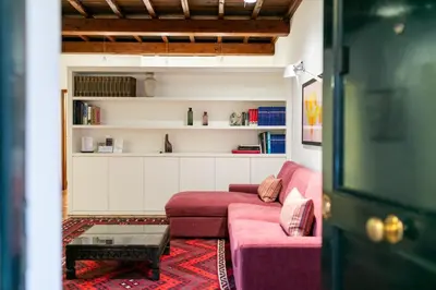 a living room with a painting of a tiger on the wall at Incentrum in Rome