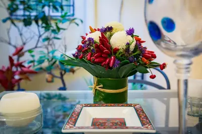 a vase filled with flowers on top of a table at Savelli Apartment in Rome