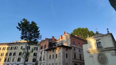 a group of buildings and a clock tower at Snooze Trastevere House in Rome