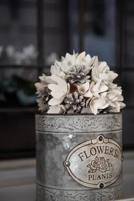 a metal can with a flower arrangement in it at Sweet Arco Farnese in Rome