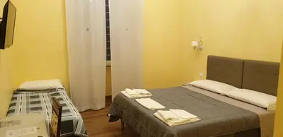 a hospital room with a bed with towels on it at La Breccia A Porta Pia in Rome