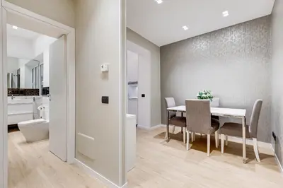 a kitchen and dining room with a table and chairs at Charming Studio - Spanish Steps in Rome
