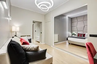 a living room with a bed and a couch at Charming Studio - Spanish Steps in Rome