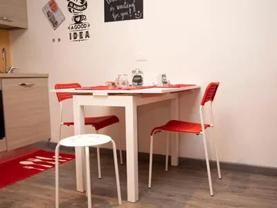 a table and four chairs in a kitchen at San Pietro apart in Rome