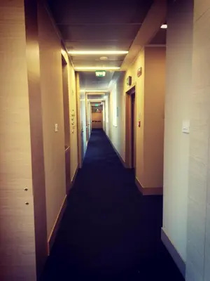 a corridor of a hotel with a long hallway at Hotel Il Cantico St. Peter in Rome