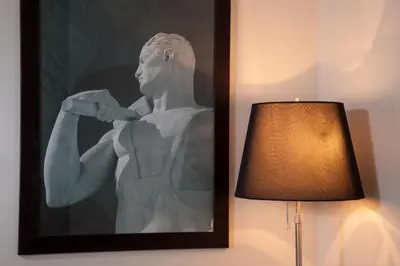a picture of a statue next to a lamp at Nazionale 51 Group in Rome