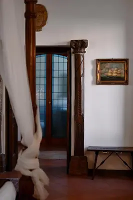 a hallway with a door and a painting on the wall at Vicolo dell'Aquila - Residenze Romanae in Rome