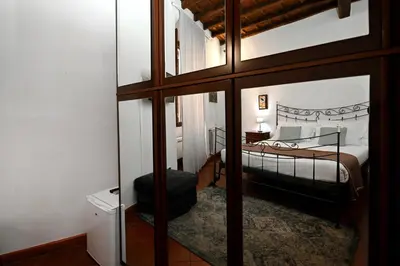 a bedroom with a bed and a glass wall at Vicolo dell'Aquila - Residenze Romanae in Rome