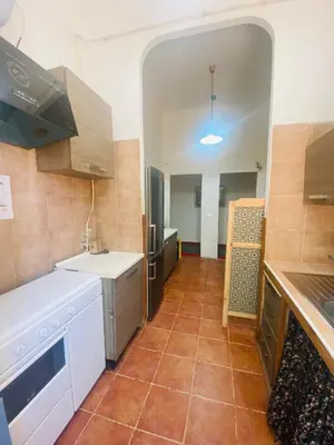 a kitchen with white appliances and a tile floor at ROMA GONDOLA SRLS in Rome
