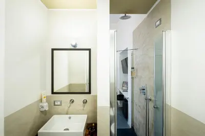 a bathroom with a sink and a mirror at Fastime in Rome