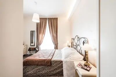 a bedroom with a bed and a window at Al Relais in Rome