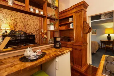 a kitchen with wooden cabinets and a counter top at The Dreamers House in Rome