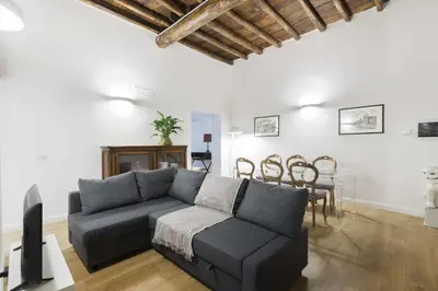 a living room with a couch and a table at Corso 101 in Rome