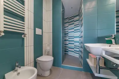 a bathroom with a toilet and a sink at GuestHost - Piazza Navona Panoramic Penthouse in Rome