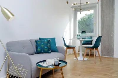 a living room with a couch and a table at RENOVATED AND COZY FLAT in Rome