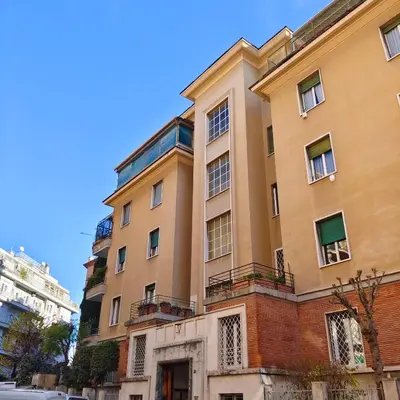 an apartment building in the middle of a street at Ada Home in Rome