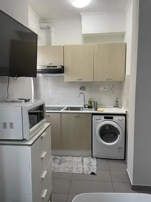 a kitchen with a sink and a counter top at Roman Art Apartment - Metro C to Colosseum in Rome