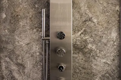 a metal door with two buttons on a stone wall at Argileto Terra in Rome