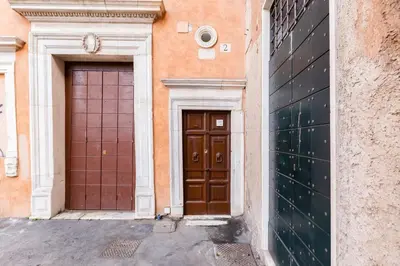 two doors on the side of a building at Klioos Apartment in Rome