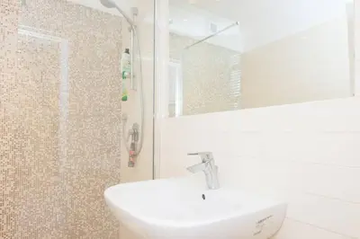 a bathroom with a sink and a mirror at SvHome in Rome