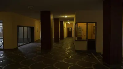 a hallway with columns and a room with a hallwayngth at A un passo dal centro in Rome