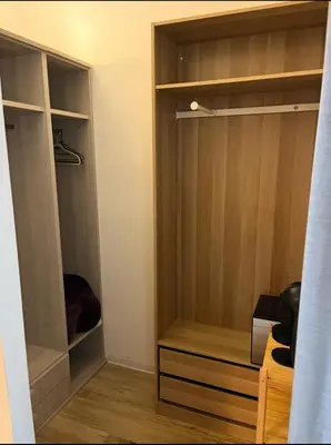 a closet with wooden shelves and a wooden floor at A un passo dal centro in Rome
