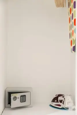 a microwave sitting on top of a counter with a telephone at RomeEyes apartment in Rome