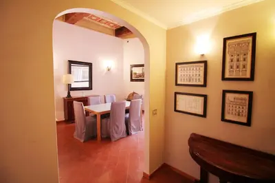 a dining room with a table and chairs at Family 2BR Apartment in Via Giulia in Rome