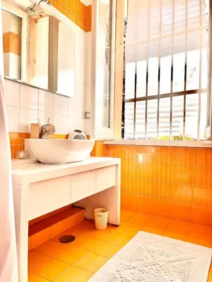 a bathroom with a sink and a mirror at Glory House Trastevere in Rome