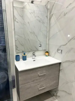 a bathroom with a sink and a mirror at San Peter Vale House in Rome