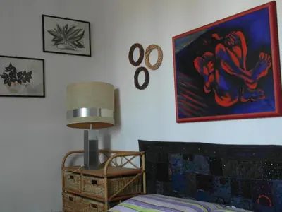 a living room with a couch and a table with a lamp at Abitazione Pigneto B&B in Rome
