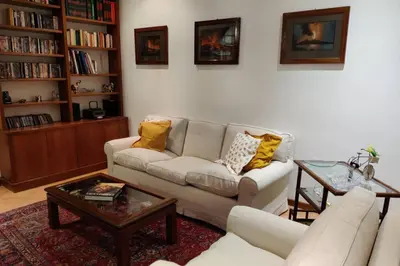 a living room with a couch and a coffee table at Lanza Tomasi Apartment - centre in Rome