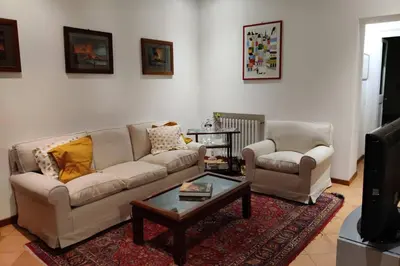 a living room with a couch and a coffee table at Lanza Tomasi Apartment - centre in Rome