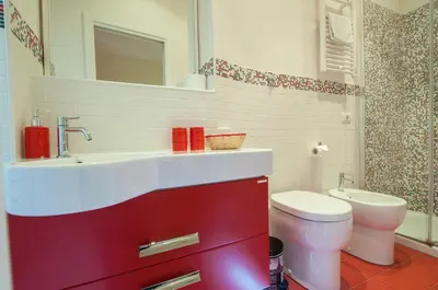 a bathroom with a sink and a toilet at Demi's home in Rome