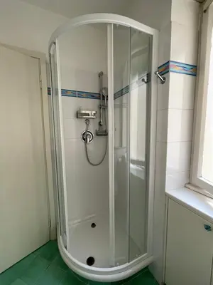 a shower with a glass door in a bathroom at Questa casa non è un albergo CIU-ATR 9390-9 in Rome