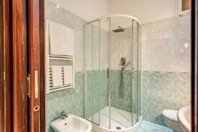 a bathroom with a shower and a sink at FRESH HOUSE CAVOUR in Rome