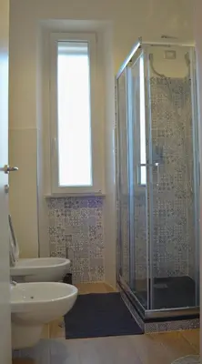 a bathroom with a shower and a toilet and a sink at Sophie's Choice 2 a San Pietro in Rome