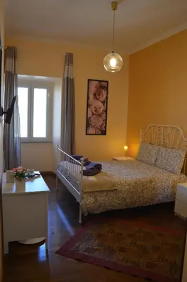 a bedroom with a bed and a crib in it at Sophie's Choice 2 a San Pietro in Rome