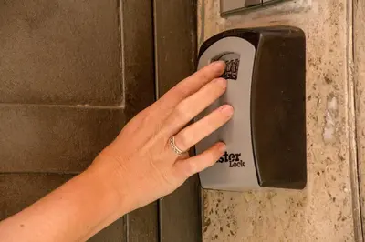 a woman is pressing a door handle with her hand at Flaminia Charme in Rome