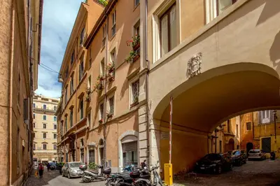 an alley with motorcycles parked next to a building at Flaminia Charme in Rome
