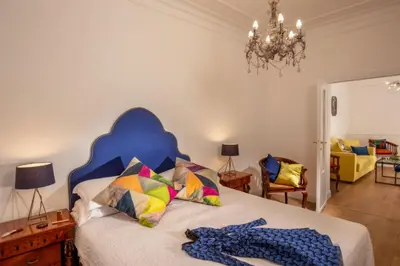 a bedroom with a bed with a blue head board at Daplace - Flaminia Apartment in Rome