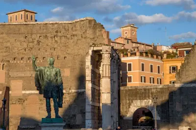 a statue of a man standing in front of a wall at Daplace - Flaminia Apartment in Rome