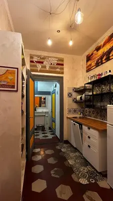 a kitchen with a hallway leading to a dining room at Da Vinci in Rome