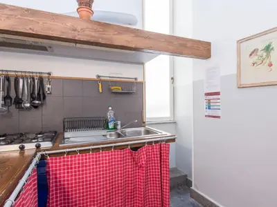 a kitchen with a sink and a stove at Apartment Romantico by Interhome in Rome