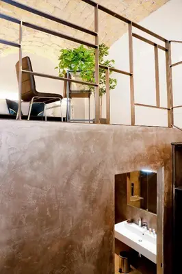 a bathroom with a sink and a mirror at Post Industrial Loft Trastevere - Top Collection in Rome