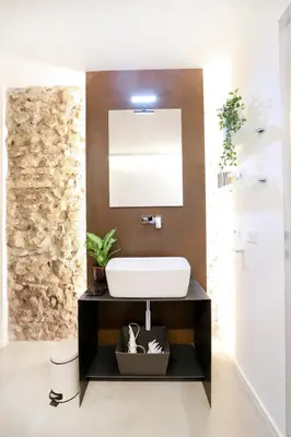 a bathroom with a sink and a mirror at Sky Dream Loft Trastevere in Rome