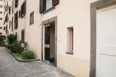 a white building with a door on a street at Silver Luxury Jacuzzi Suite Trastevere in Rome