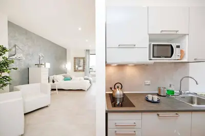 two images of a kitchen and a living room at White Panoramic Jacuzzi Suite Trastevere in Rome