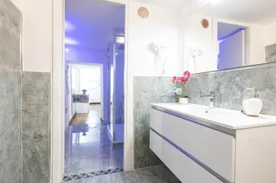 a bathroom with a sink and a mirror at Campo dè Fiori Detached Apartment Eligio - Top Collection in Rome
