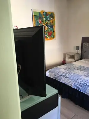 a flat screen tv sitting on a dresser in a room at B&B Affaccio sul Vaticano in Rome